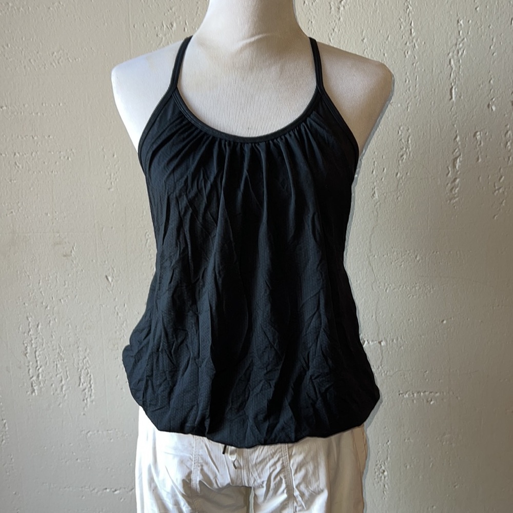lulu tank size 8. Bra with loose fitting tank over it, open armpits.